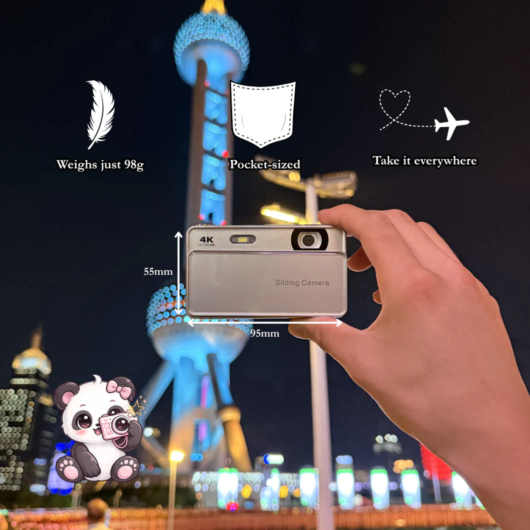 Digislide sliding camera being held in one hand at night — 95mm × 55mm, weighs just 98g, pocket-sized